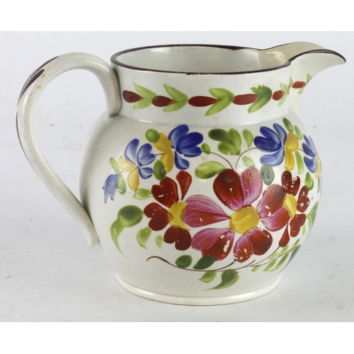 473 - Swansea Pottery jug with handpainted floral decoration, height 11cm approx.