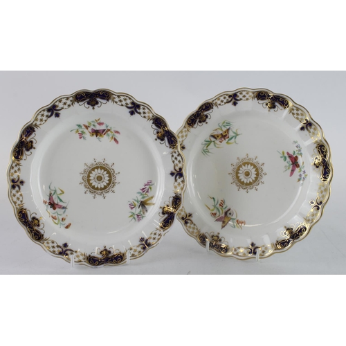 477 - Two hand painted plates, decorated with butterflies, one plate with impressed diamond mark to revers... 