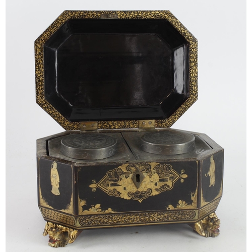 565 - Chinese lacquered tea caddy, raised on four dragon feet, decorated with traditional scenes, with two... 