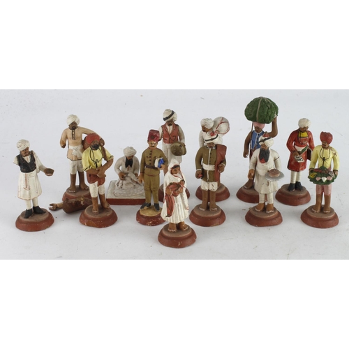 576 - Figures. A group of clay figures thought to of been brought back by a serviceman during WWI, height ... 