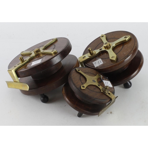 578 - Fishing Reels. Three wooden fishing reels with brass mounts, including one stamped 'S. Allcock & Co.... 