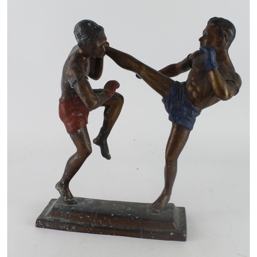 587 - Kickboxing interest. A bronzed kickboxing statue / trophy, height 37cm, length 32cm approx.