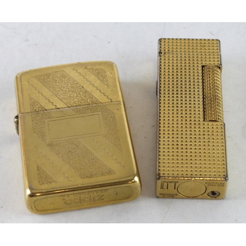 591 - Lighters. Two gold plated lighters, comprising a Zippo & Dunhill