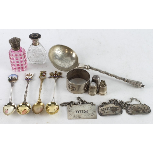 615 - Silver & White Metal. A group of various items including silver teapoons, silver bottle labels, perf... 