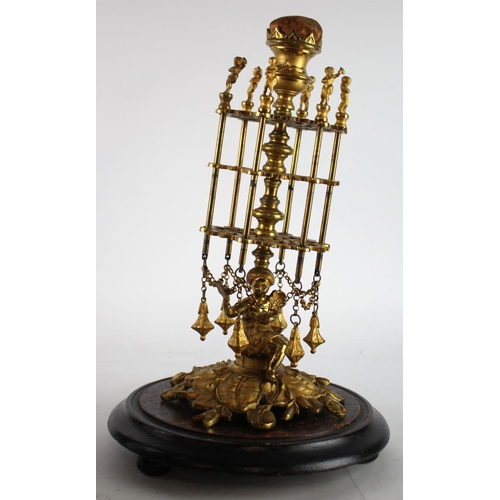 628 - Victorian gilt brass bobbin holder, with ornate decoration on a wooden base, total height 40cm appro... 