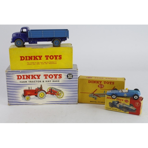 91 - Dinky Toys. Four boxed Dinky Models, comprising Farm Tractor & Hay Rake (no. 310); Comet Wagon with ... 