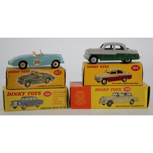 92 - Dinky Toys. Four boxed Dinky models, comprising Rolls Royce Phantom V (no. 198); Mercedes Benz 220 S... 