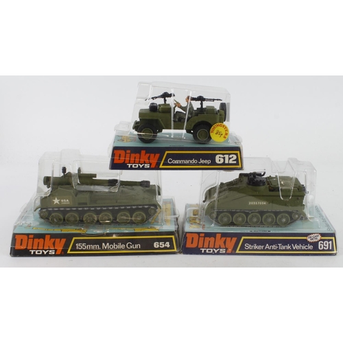 97 - Dinky Toys. Three Dinky Military models, comprising Commando Jeep (no. 612); 155mm Mobile Gun (654);... 