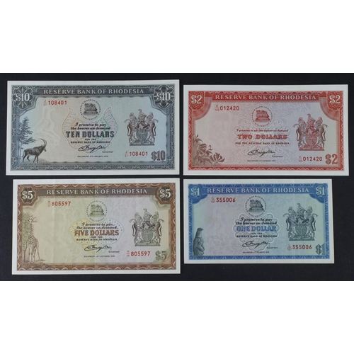 857 - Rhodesia (4), 10 Dollars dated 1979 about Uncirculated, 5 Dollars dated 1978 VF+, 2 Dollars dated 19... 