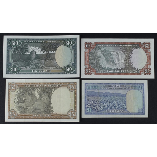 857 - Rhodesia (4), 10 Dollars dated 1979 about Uncirculated, 5 Dollars dated 1978 VF+, 2 Dollars dated 19... 