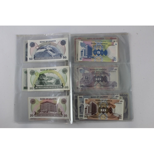 919 - Uganda (35), an Uncirculated group in album pages, 5 Shillings, 10 Shillings, 20 Shillings, 50 Shill... 