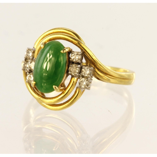 102 - 18ct yellow gold ring set with oval jade cabochon measuring approx. 9mm x 5.5mm, with eight round br... 