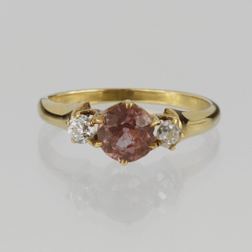 108 - 14ct yellow gold three stone ring set with central 6mm diameter pink sapphire, with a round old cut ... 