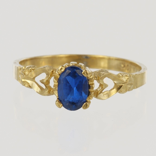 112 - 10ct yellow gold ring set with oval blue paste measuring approx. 6mm x 4mm, finger size L, weight 1.... 