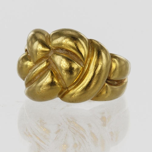 113 - Tests as 18ct yellow gold knot ring, head approx. 15mm wide, finger size P, weight 7.0g