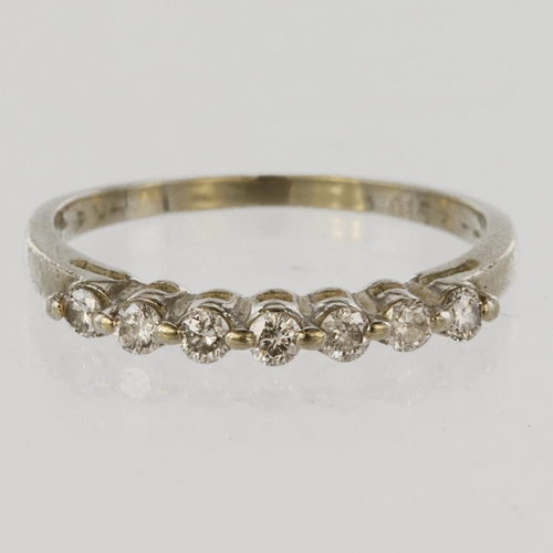 126 - 14ct white gold half eternity ring set with seven round brilliant cut diamonds, total diamond weight... 