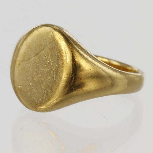 136 - 18ct yellow gold signet ring with plain oval head measuring approx. 14mm x 11mm, finger size Q, weig... 