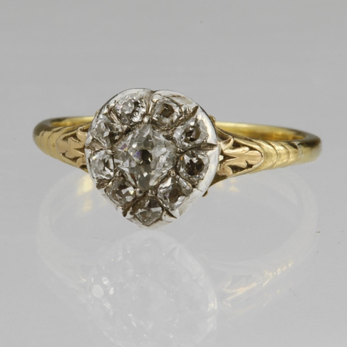 147 - 18ct yellow gold heart shaped cluster ring set with ten round old cut diamonds in a silver setting, ... 