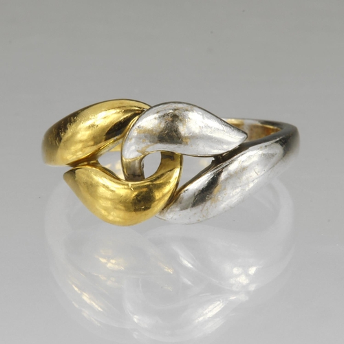 149 - 18ct yellow and white gold knot ring, head width 11mm, finger size R/S, weight 7.4g.