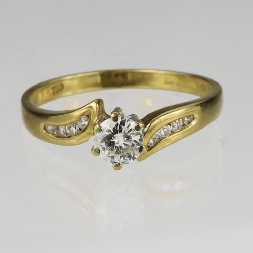 15 - 18ct yellow gold crossover style ring set with a round brilliant cut diamond with diamond set should... 