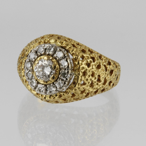 152 - 18ct bombe shaped ring with pierced and textured shoulders, set with a centre round brilliant cut di... 