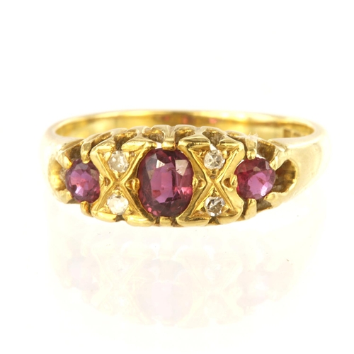 168 - 18ct yellow gold ring set with three graduated rubies, centre oval ruby measuring approx. 4.5mm x 3.... 