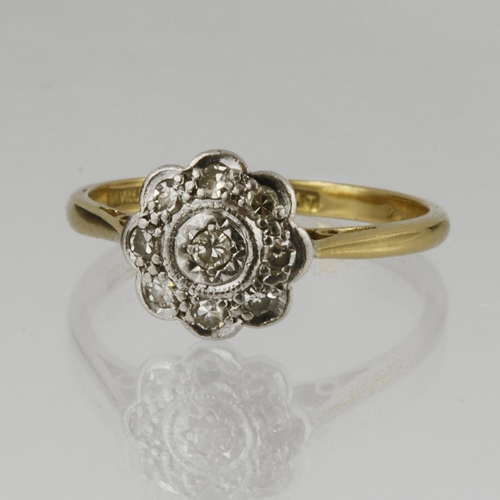 174 - 18ct yellow gold and platinum daisy cluster ring set with nine round brilliant cut diamonds, total d... 