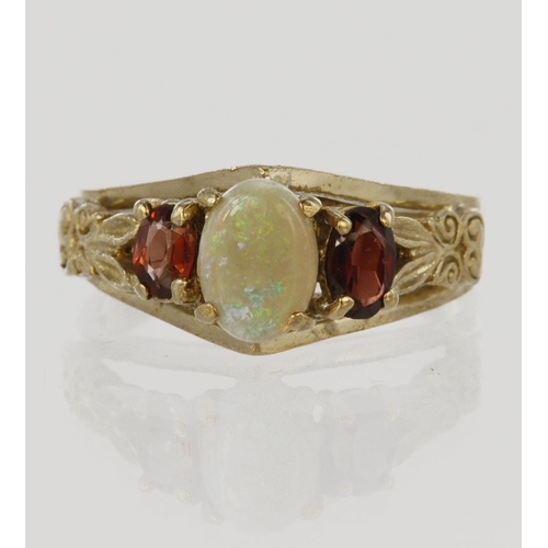 185 - 9ct yellow gold three stone dress ring set with central oval opal cabochon measuring approx. 7mm x 5... 