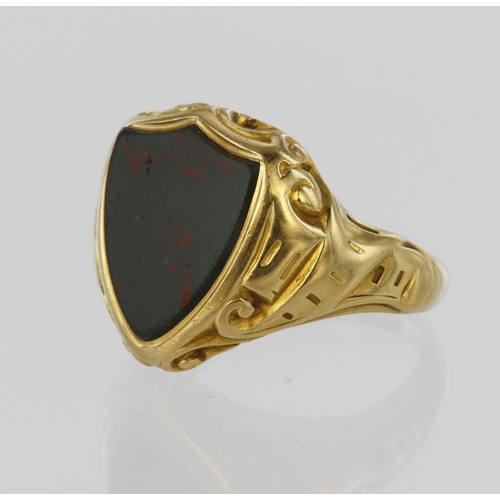 193 - Tests as 18ct yellow gold signet ring set with shield shaped bloodstone measuring approx. 13mm x 11m... 