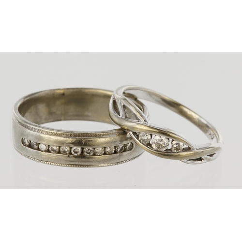 479 - Two rings to include a 10ct white gold band ring set with three graduated round brilliant cut diamon... 