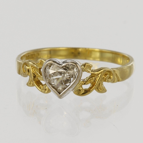 48 - 18ct yellow gold with white gold rub over setting, set with a single heart shaped diamond calculated... 