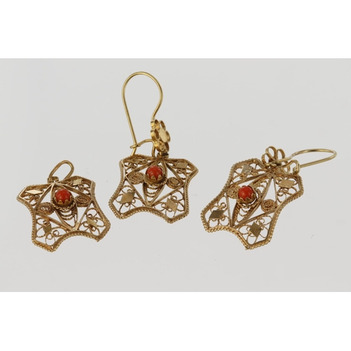 494 - Suite of matching pendant and earrings, rectangular filigree plaque set with central coral cabochon ... 