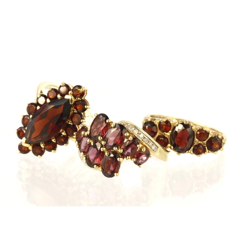 501 - 9ct yellow gold marquise garnet cluster ring measuring approx. 20mm x 13mm, finger size L, weight 3.... 