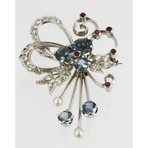 503 - 18ct white gold brooch by Garrard & Co., set with twenty one round brilliant cut diamonds, five blue... 