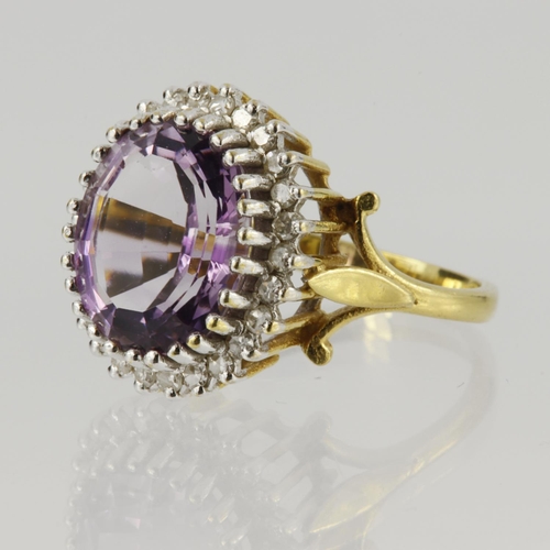 54 - 18ct yellow gold cluster ring set with a central oval amethyst measuring approx. 12mm x 9mm, surroun... 