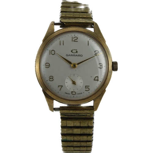 613 - Gents 9ct cased Garrard manual wind wristwatch, circa 1964. The silvered dial with gilt Arabic numer... 