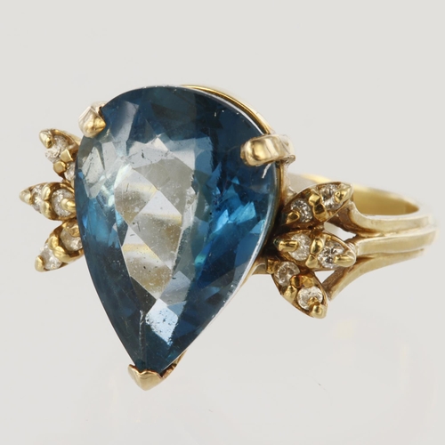 66 - 14ct yellow gold dress ring featuring a pear shaped London blue topaz measuring approx. 15mm x 8mm, ... 