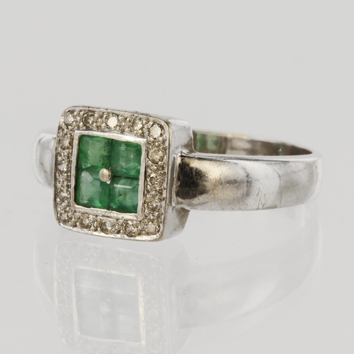 72 - 9ct white gold ring set with four princess cut emeralds set together in a rub over collet measuring ... 