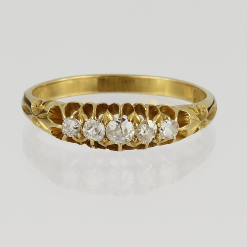 77 - Stamped 18ct yellow gold graduated five stone ring set with round old cut diamonds, total diamond we... 