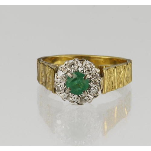 87 - 18ct yellow gold cluster ring set with central round emerald measuring approx. 4mm diameter, surroun... 