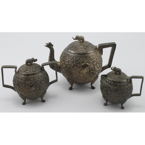 884 - Victorian white metal ornately decorated tea set, comprising teapot, sugar bowl and milk jug, teapot... 