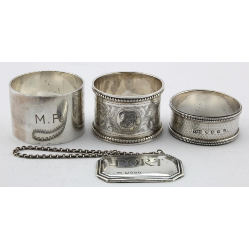 885 - Three silver napkin rings hallmarked Birm. 1877, 1910 and 1945 plus a silver 