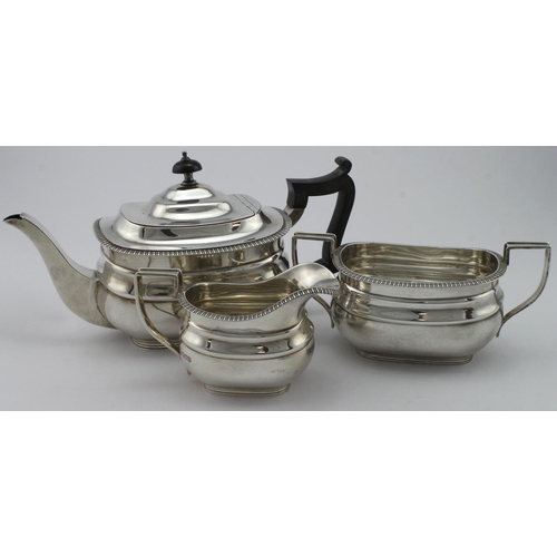 899 - Three piece silver tea set comprising teapot (with wooden handle & finial) milk jug and sugar bowl a... 