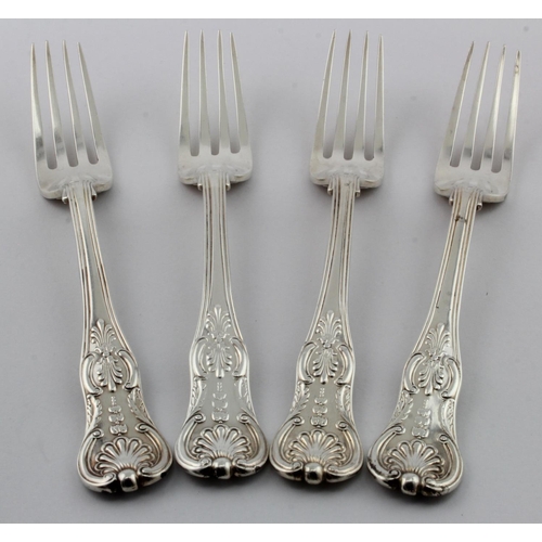 910 - George IV, heavy gauge, four silver Kings Honeysuckle pattern table forks with Anthemion or Honeysuc... 