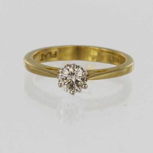 93 - 18ct yellow gold solitaire ring with platinum six claw mount holding a round brilliant cut diamond c... 