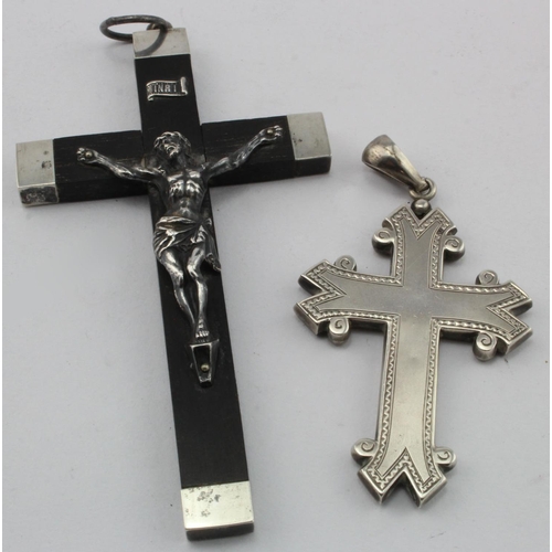 934 - Two crosses, one appears to be Victorian and made of unmarked silver, the other one appears to have ... 