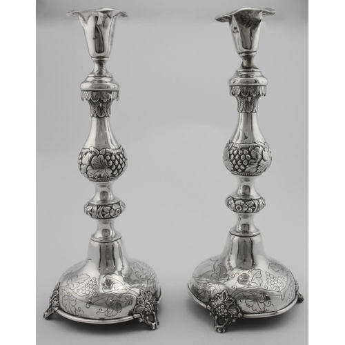 936 - Pair of Russian ornate silver candlesticks both bear marks for Pogorzelski, Minsk, OC c1875, 84 zolo... 