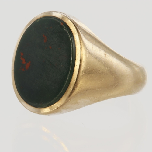 98 - 9ct yellow gold oval head signet ring set with a 17mm x 12mm bloodstone, finger size T, weight 12.3g