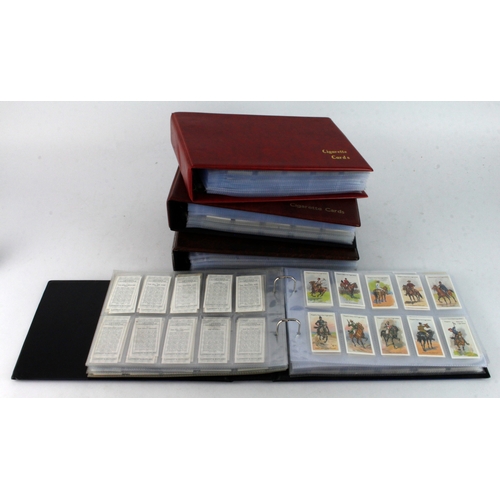 504 - Box containing 4x modern albums with 50+ complete sets of reproduction Cigarette cards in plastic pa... 