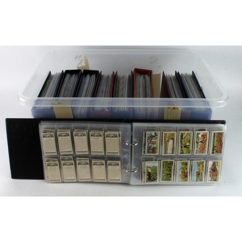 587 - Large plastic crate housing 9x modern albums with 130+ complete sets of Cigarette cards, many issuer... 